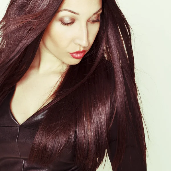 Portrait of sexy beautiful young woman in black leather dress — Stock Photo, Image