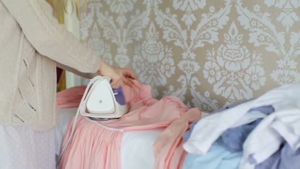 Female hands stroked dress iron — Stock Footage Female hands stroked dress iron Video Clip