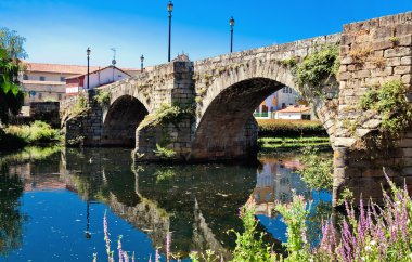 old Roman bridge in Monforte de Lemos, Galicia, Spain clipart