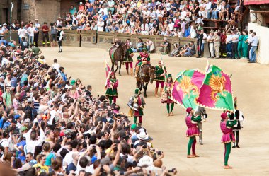 Parade before start of annual traditional Palio di Siena horse race in medieval square 