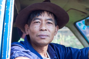 Thai farmer after a hard day going home. Province of Chiang Mai, Thailand