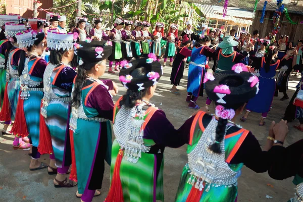 Ritual dance of women in national costumes during the Spring Festival (Chinese New Year) in mountain village of Lisu