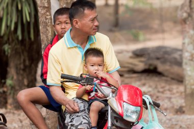 Family riding on a motorcycle in province of Loei Thailand