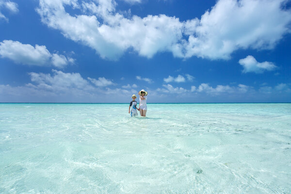 Woman, boy and Caribbean sea