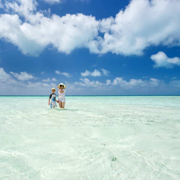Woman, boy and Caribbean sea