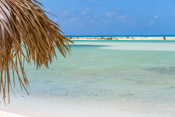 Beach Umbrella on exotic beach — Stock Photo, Image