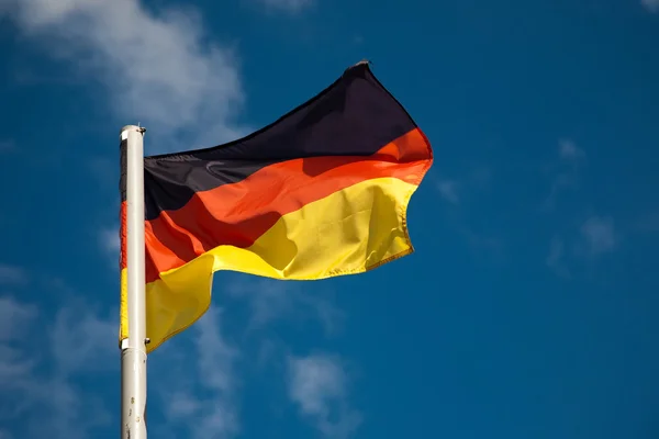 German flag against blue sky — Stock Photo, Image