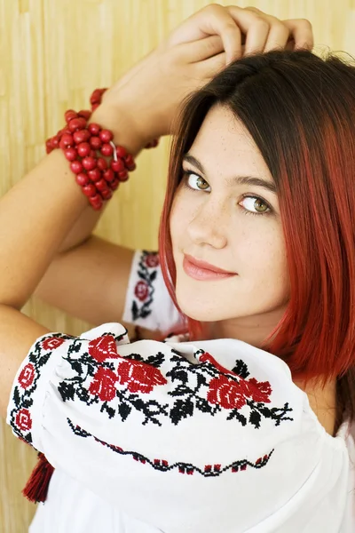Beautiful Ukrainian girl in traditional embroidered shirt and green eyes — Stock Photo, Image