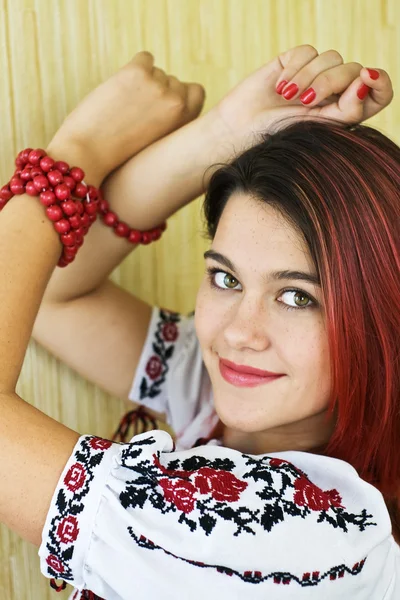 Beautiful Ukrainian girl in traditional embroidered shirt and green eyes — Stock Photo, Image