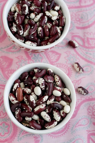 Coloured Bean is a traditional Turkish dishes on pink background — Stock Photo, Image