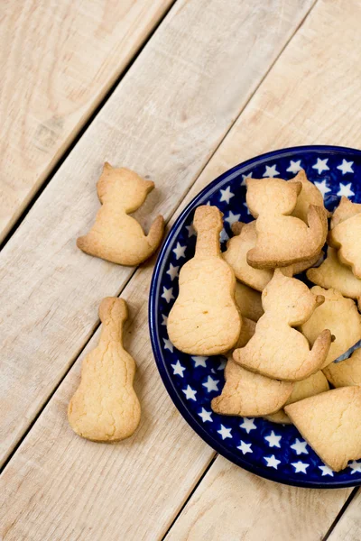 Blue plate in the stars, with tasty cookies in the form — Stock Photo, Image