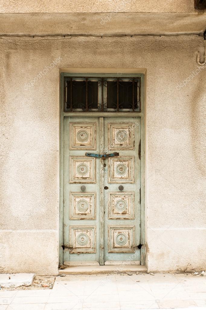 Locked Wooden Front Door of the Old House with Big Lock in Mahdi