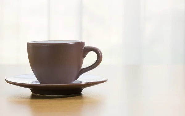 Coffee cup on wood table — Stock Photo, Image
