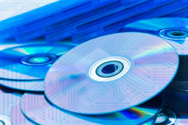 Closeup compact discs (CD/DVD) with the circuit board — Stock Photo, Image