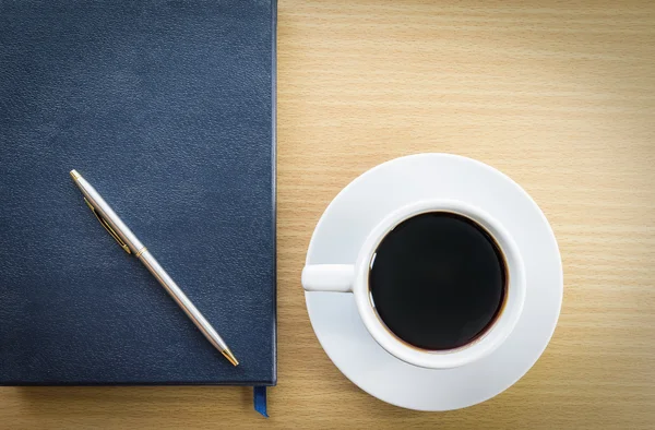 Coffee cup and notebook — Stock Photo, Image