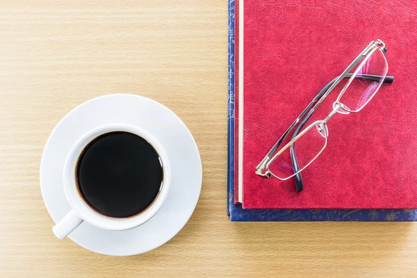 Coffee on a wood table and glasses — Stock Photo, Image
