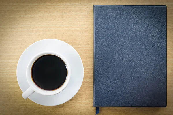 Caderno e xícara de café — Fotografia de Stock