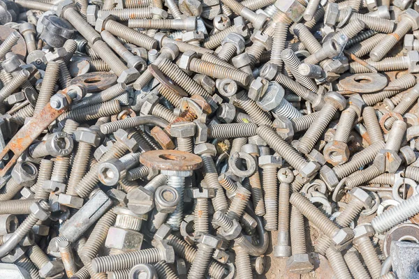 Close up of different old bolts, screw and nuts — стоковое фото