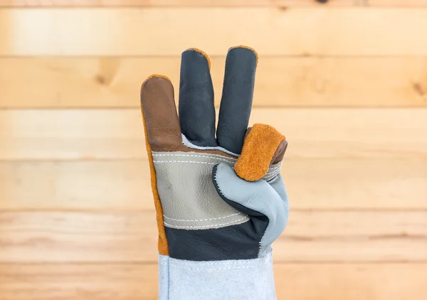 Hand in rough leather glove — Stock Photo, Image