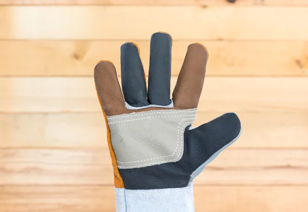 Hand in rough leather glove — Stock Photo, Image