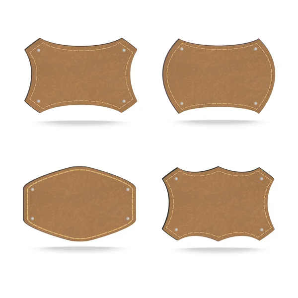 Set de etiquetas de cuero sobre fondo blanco — Vector de stock