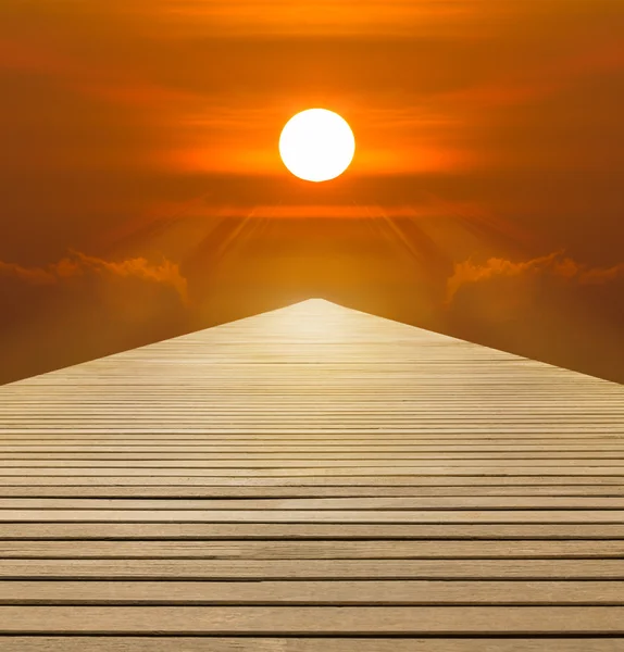 Red sunset over  wood walkway — Stock Photo, Image