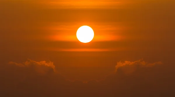 Sunrise over clouds with bright yellow sun on a morning — Stock Photo, Image