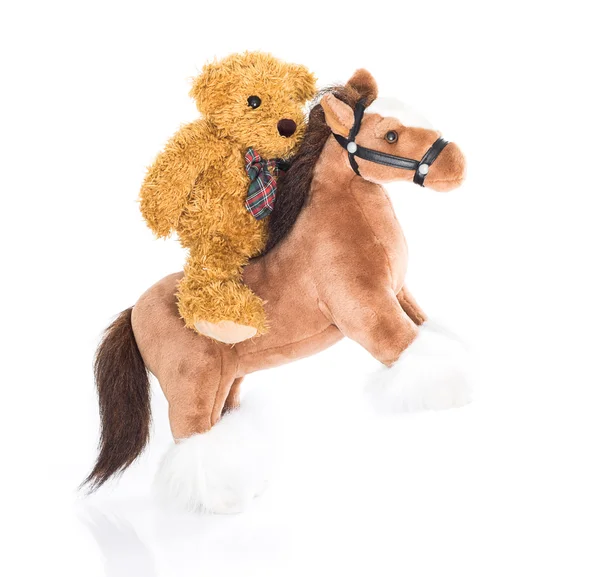 Плюшевий ведмедик верхи на коні — стокове фото