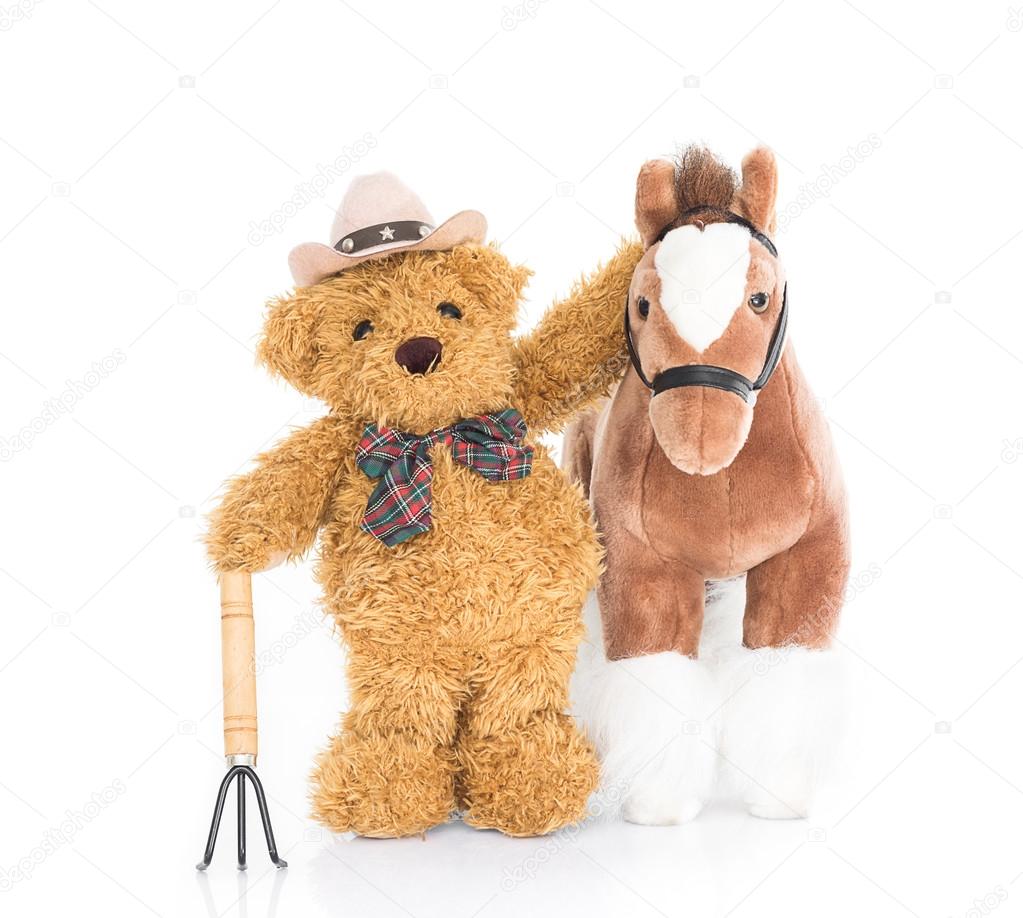 Teddy bear farmer with pitchfork  and horse