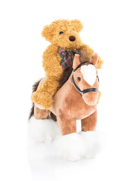 Osito de peluche montando un caballo —  Fotos de Stock