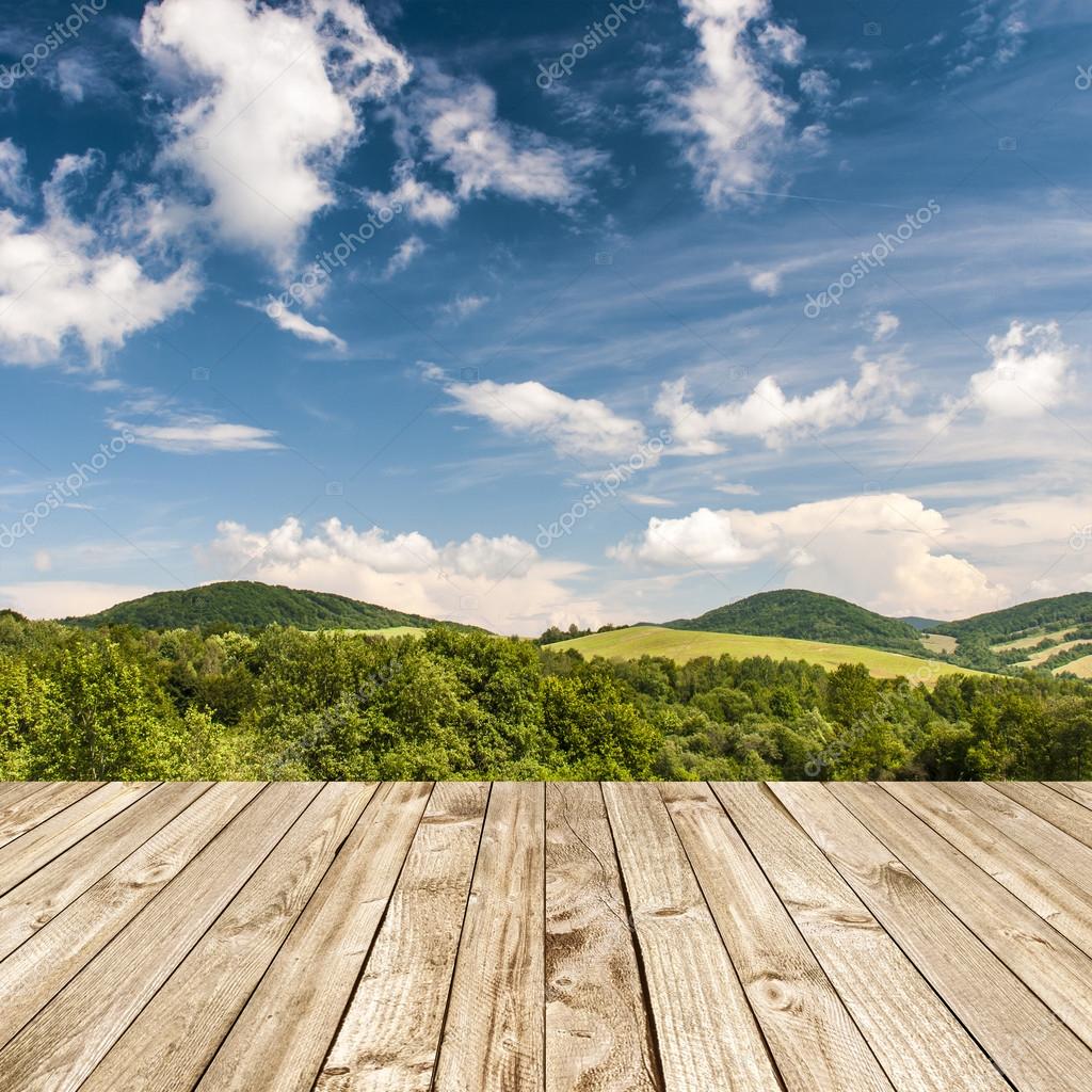 Wood terrace and perspective view on forest hills — Stock Photo © zajac
