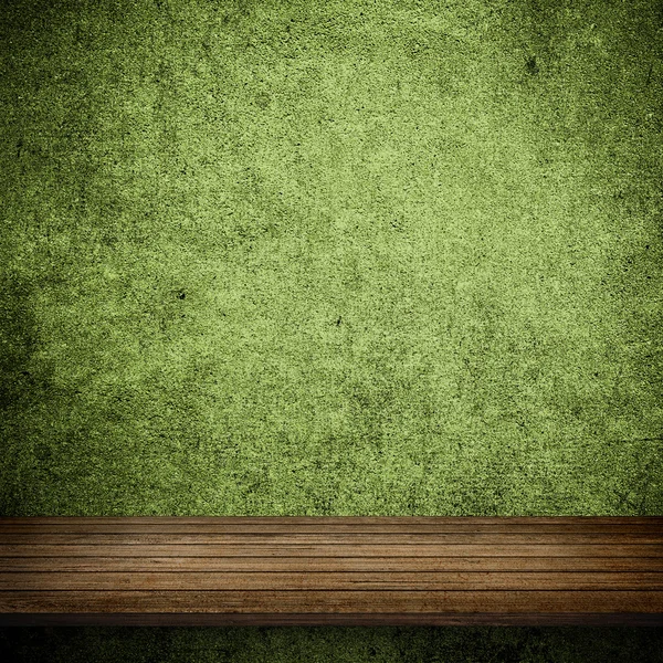 Wood table and green concrete wall — Stock Photo, Image