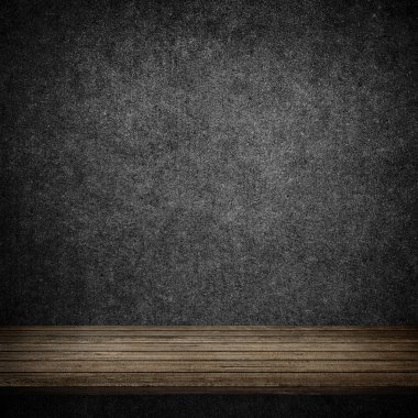 Ahşap masa ve gri beton duvar