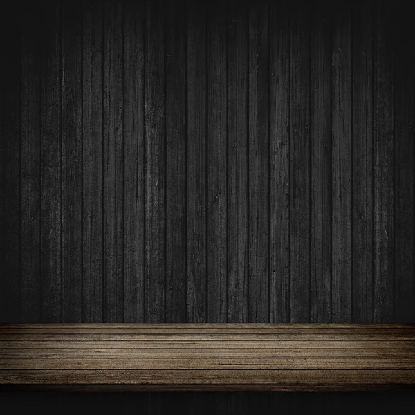 Dřevěný stůl a šedou betonovou zeď — Stock fotografie
