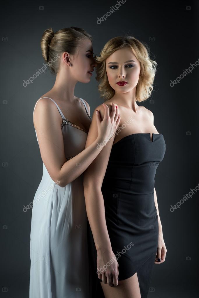 Two young beautiful women in cocktail dresses — Stock Photo