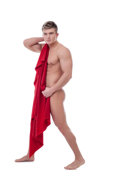 Handsome young guy covers his nakedness with cloth — Stock Photo, Image