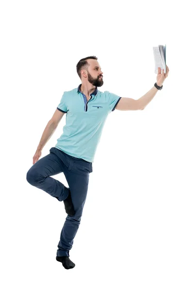 Time to relax. Guy reading book while doing asana — Stock Photo, Image