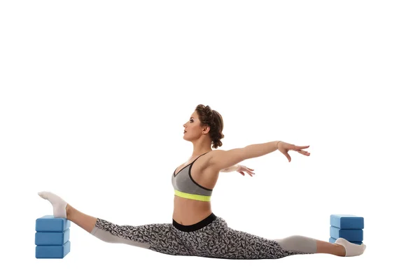 Image of gymnast exercising using gymnastic bricks — Stock Photo, Image