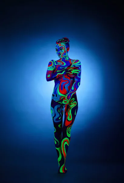 Erotica in ultraviolet light. Nude girl posing — Stock Photo, Image