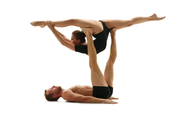 Acrobatics. Man and woman doing splits in support — Stock Photo, Image