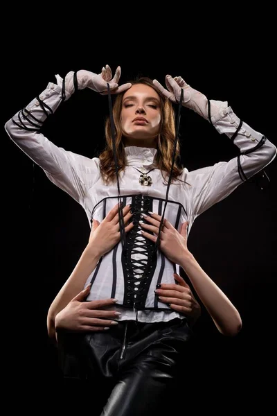 Stylish woman in corset standing in studio — Stock Photo, Image