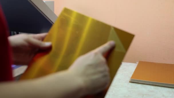 Worker using lamination machine in printing house — Αρχείο Βίντεο