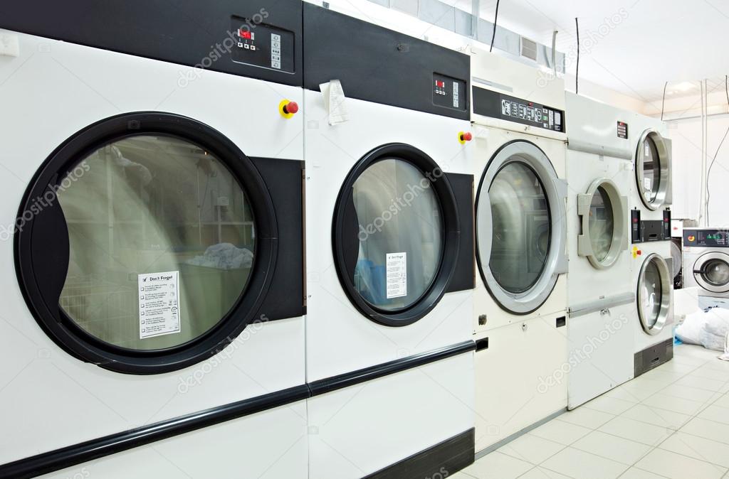Close-up on rotating drums of washing machines