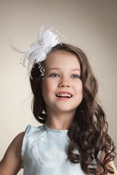 Portrait of elegant little girl posing in studio — Stock Photo, Image