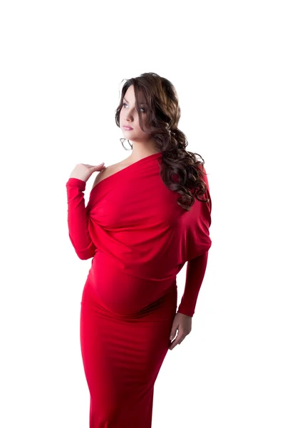 Fundersam gravid kvinna klädd i elegant klänning — Stockfoto