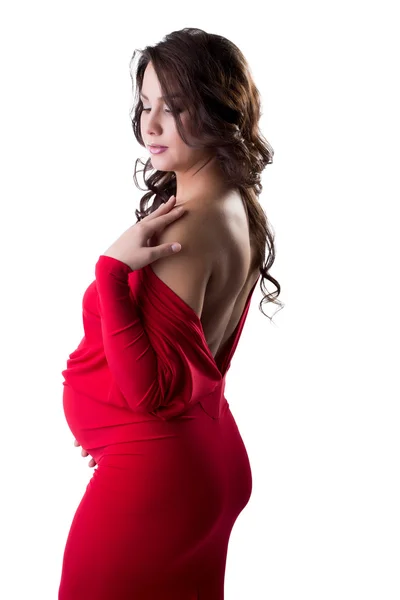 Okouzlující těhotná žena pózuje v elegantní šaty — Stock fotografie