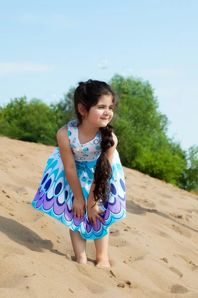 Amusing little model posing on beach — Stock Photo, Image