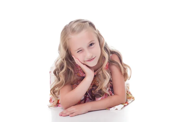 Portrait of adorable blonde girl winks at camera — Stock Photo, Image