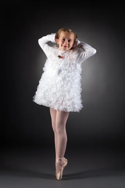 Little ballet dancer posing in white dress — Stock Photo, Image