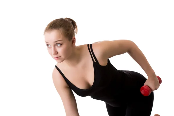 Portrait of sporty girl trains with dumbbells — Stock Photo, Image